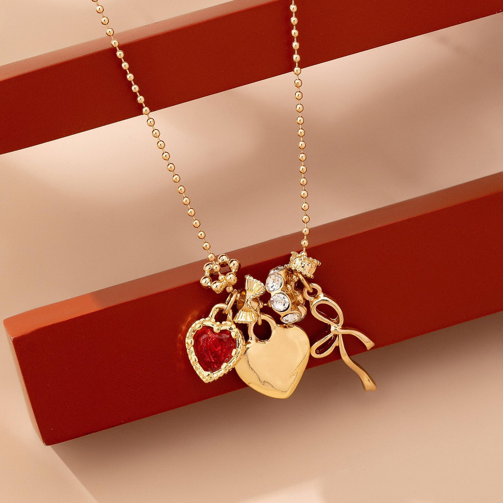Multi-Charm Heart and Bow Necklace | 80N92882: Gold