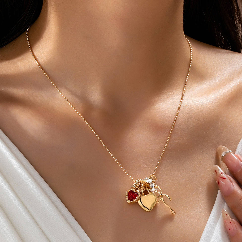 Multi-Charm Heart and Bow Necklace | 80N92882: Gold