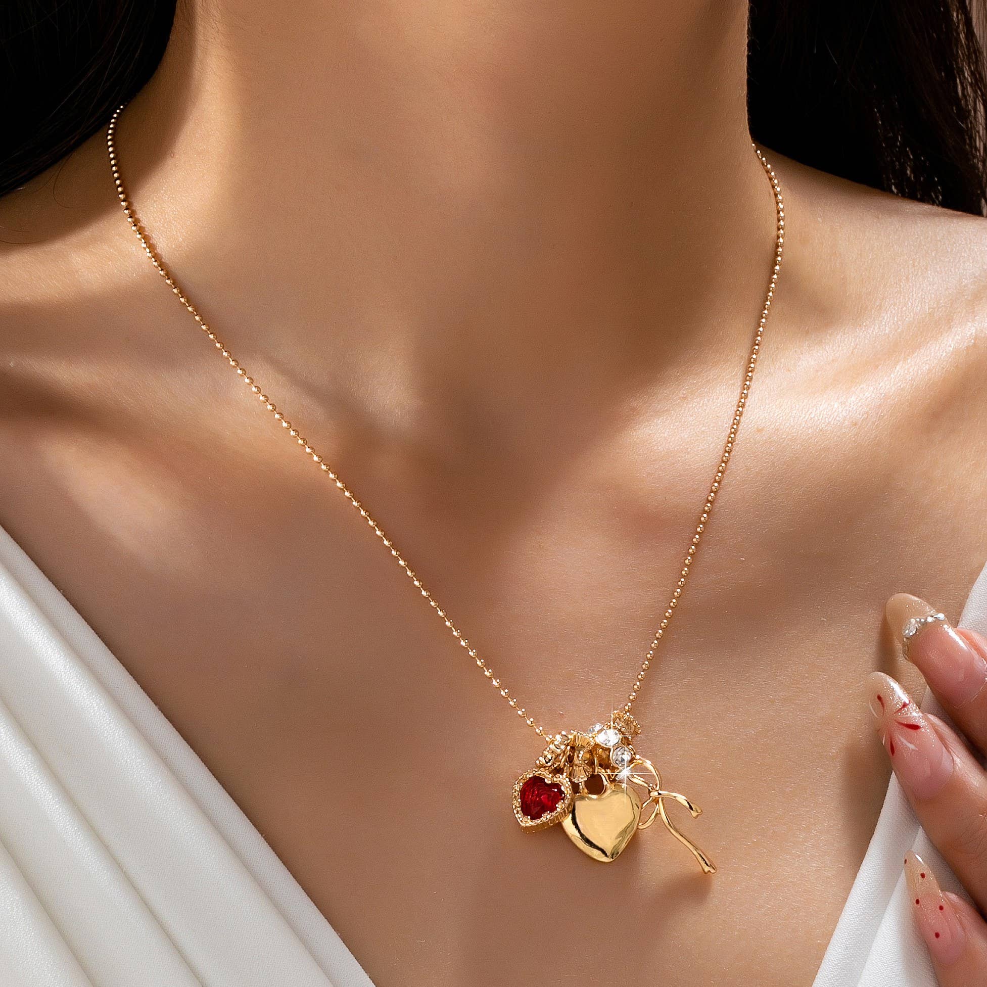 Multi-Charm Heart and Bow Necklace | 80N92882: Gold