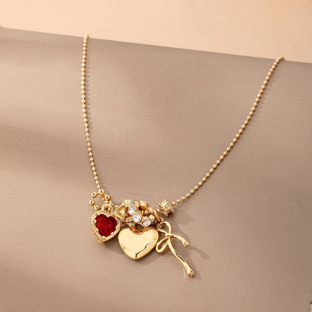 Multi-Charm Heart and Bow Necklace | 80N92882: Gold