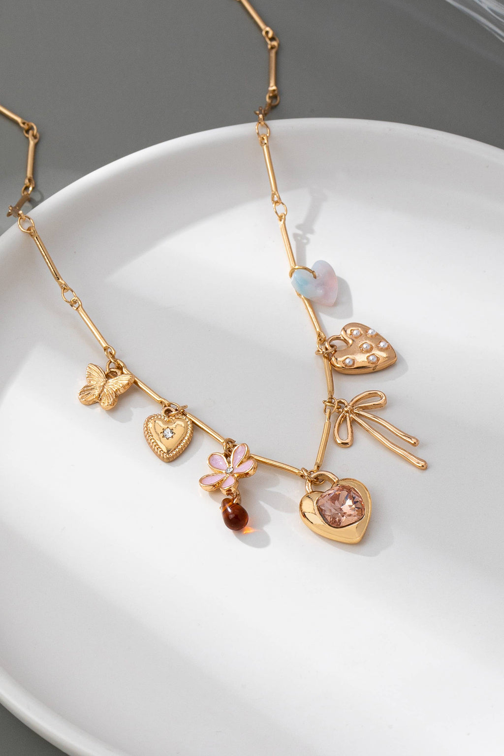 CHARM NECKLACE-HEARTS FLOWER BOW BUTTERFLY | 80N92639: GOLD