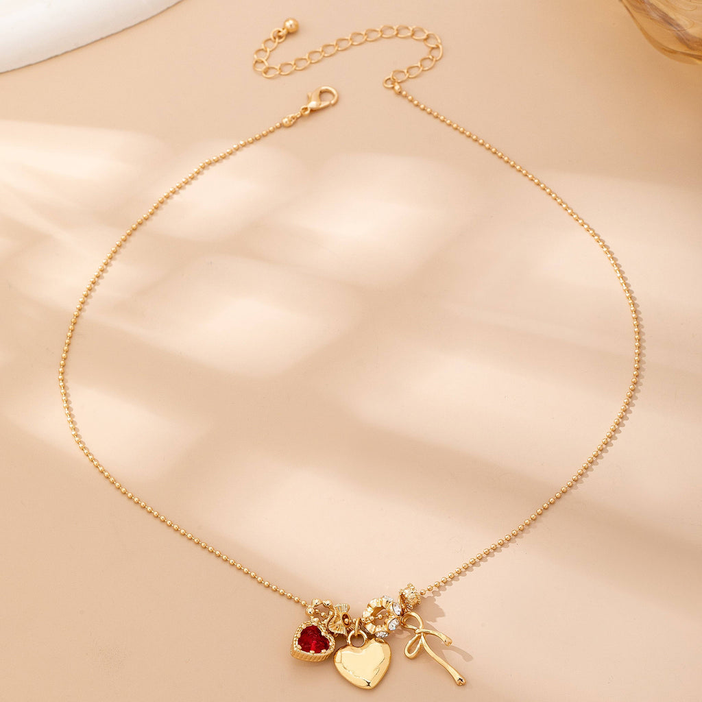 Multi-Charm Heart and Bow Necklace | 80N92882: Gold
